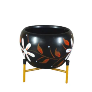 Black Metal Pot With White Flowers And Red Leaves